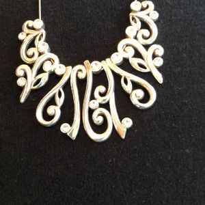 Silver color Brighton necklace with 18 inch chain.